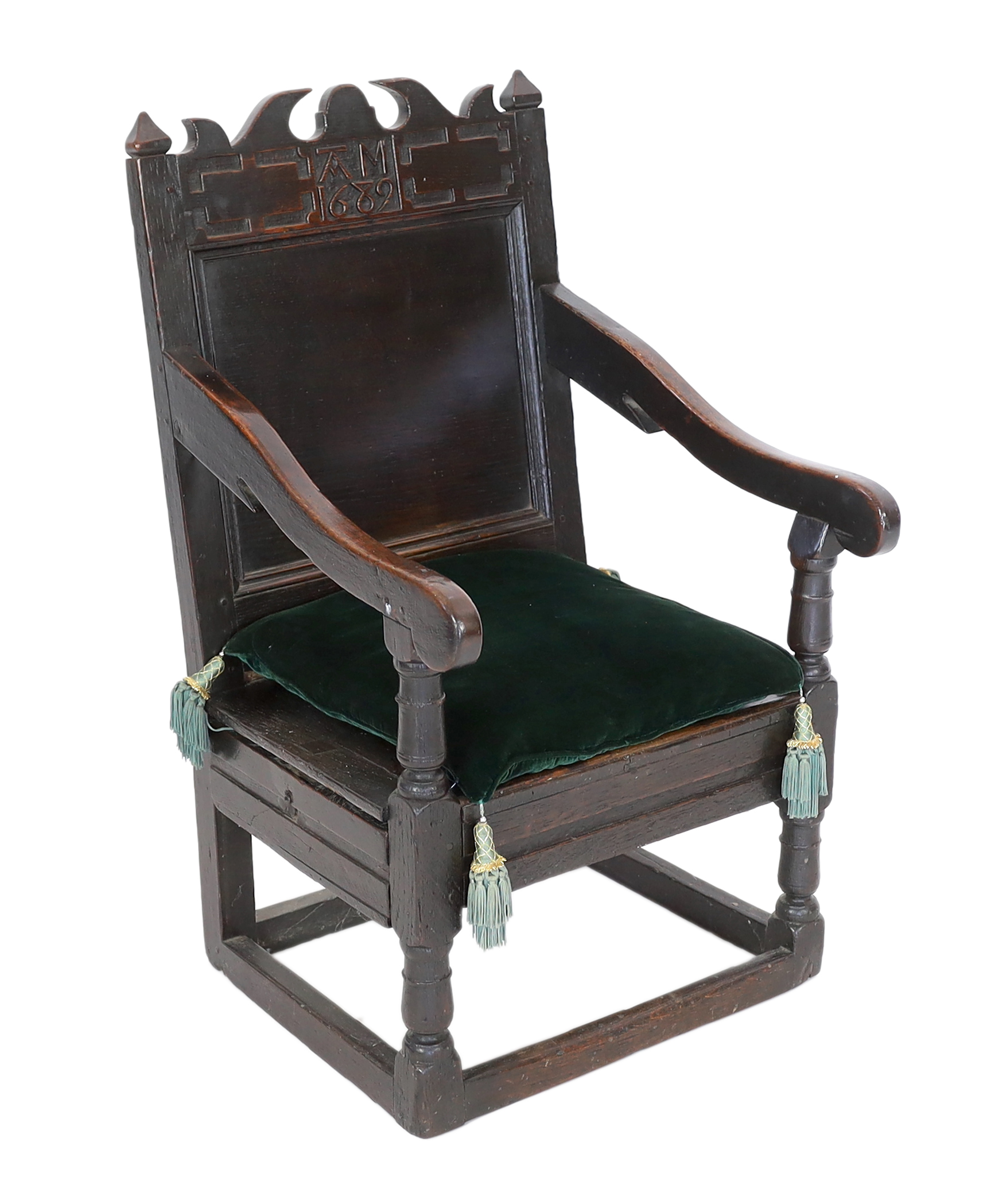 A Charles II oak armchair, of small proportions, monogrammed AM and dated 1682